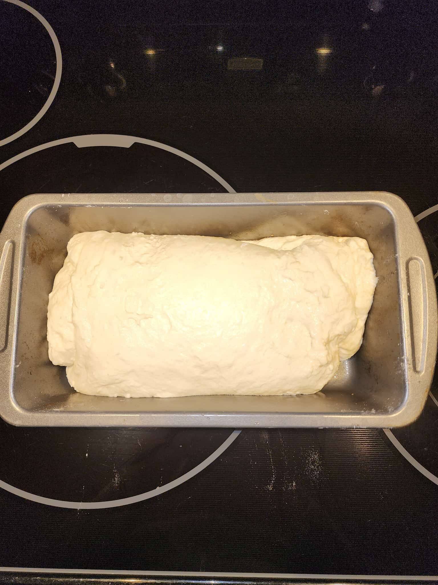 Sourdough rolled up in a bread pan.